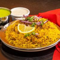 Chicken Biryani · Basmati rice cooked with boneless chicken, saffron and fresh seasoning.