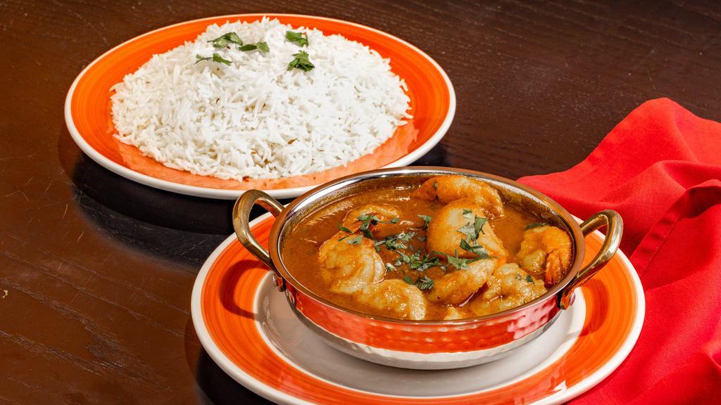Shrimp Vindalo · Shrimp cooked with potatoes in tangy curry sauce.