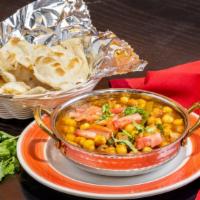 Chana Masala · Delicious chickpeas cooked in an exotic blend of Indian spices.