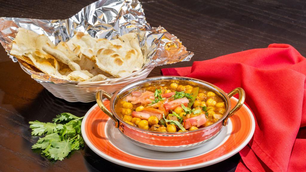 Chana Masala · Delicious chickpeas cooked in an exotic blend of Indian spices.