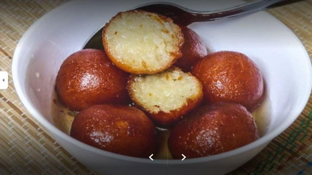 Gulab Jamun · Donuty honey balls soaked in honey syrup.