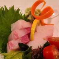 Sashimi · Nine pieces of assorted fresh raw fish.