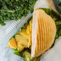 American Combo Panini · Turkey, roast beef, american cheese, lettuce and tomatoes. Hot grilled sandwiches on europea...