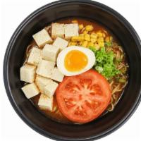 Vegetarian Tomato Ramen · Tomato Paste Mixture with Hot Water

Comes with Tomato, Green Onion, Corn, and Half a Soft B...