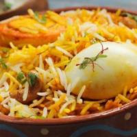 Egg Biryani · Boiled eggs cooked with flavored basmati rice. Served with our homemade raita.
