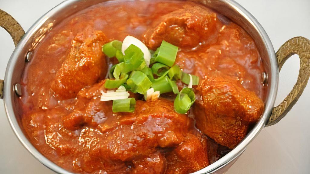 Lamb Vindaloo · Lamb with potatoes in a spicy vindaloo sauce. Served with rice.