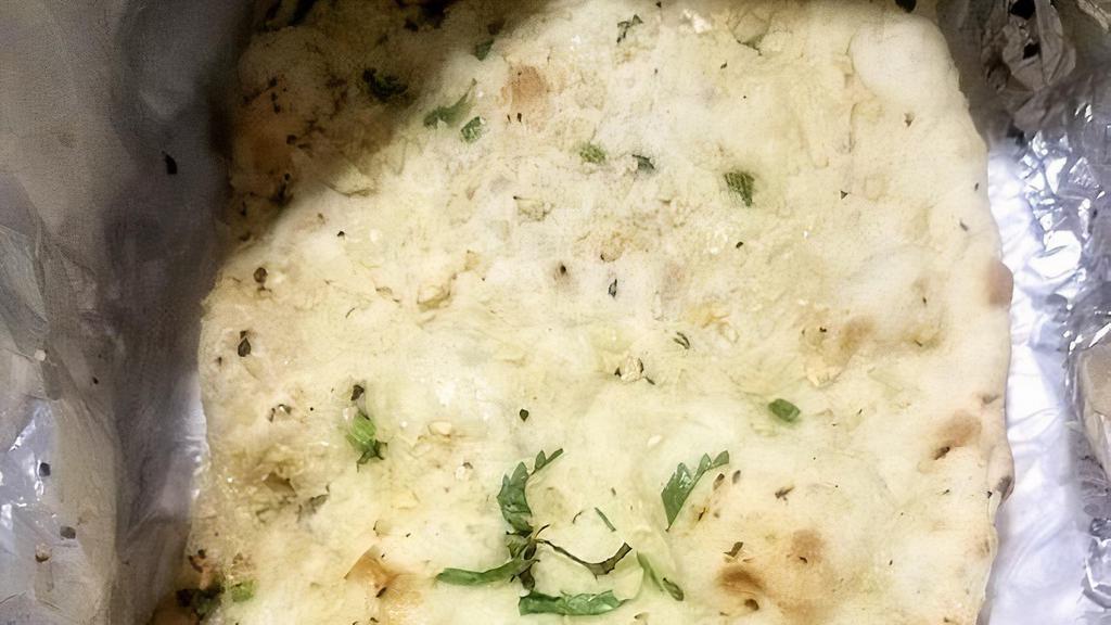 Garlic/Chilli Naan · Most popular bread with a spread of garlic and green chilly. Hot and spicy.