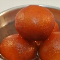 Gulab Jamun · Homemade sweet milk dumplings soaked in syrup.