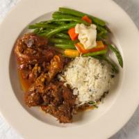 Stewed Chicken Caribbean Style Dinner · Popular Item. Served with a choice of rice and peas, spinach, coconut rice or steamed ground...