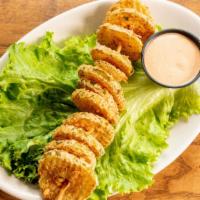Fried Fresh Pickles · Battered fresh pickle chips deep fried to a golden crisp & served with a side of chipotle ra...