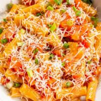 Chipotle Pasta · Rigatoni pasta sautéed in a fresh chipotle cream sauce & topped with diced tomatoes, scallio...