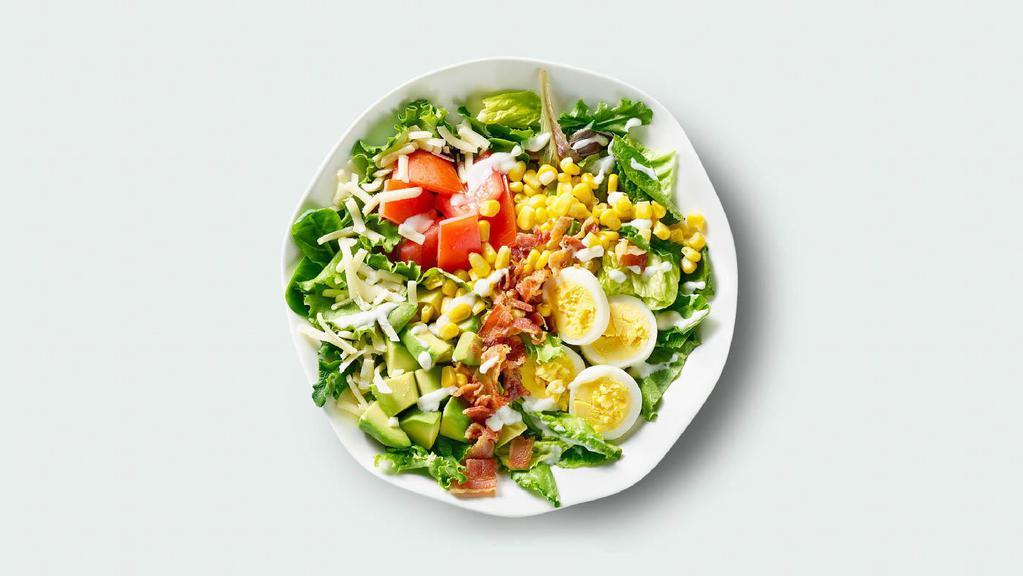 Cobb Salad · Romaine & field greens, hard boiled egg, avocado, bacon, aged cheddar, tomatoes, corn, greek yogurt ranch.