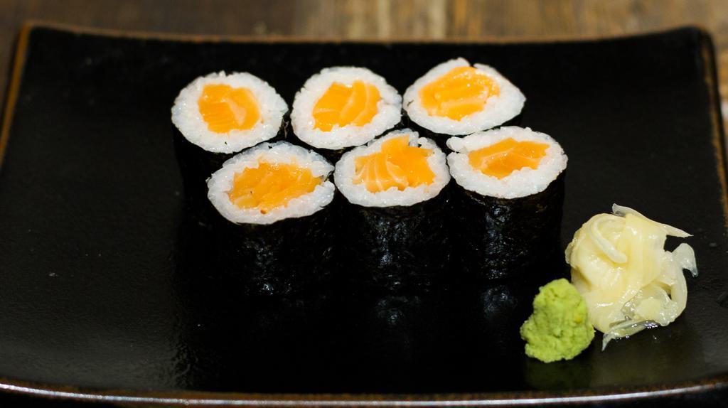 Salmon Roll · Raw sushi salmon wrapped with rice and nori