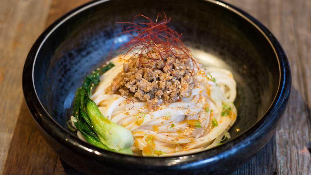 Cold Tan Tan Udon · Ground pork sesame flavored broth, scallion, bok choy, and spicy oil