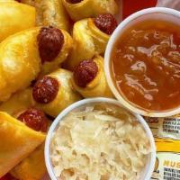 Mini Hot Dog · Plain double beef hot dog in a pastry - served with sauerkraut and sabrett red onions on the...