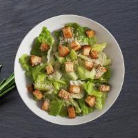 Classic Caesars Salad · Fresh crisp romaine lettuce, tossed with Caesars dressing and topped with parmigiano reggian...