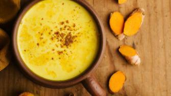 Turmeric Golden Bowl · Mango, turmeric, coconut milk, banana, vegan protein powder, topped with almonds, coconut fl...