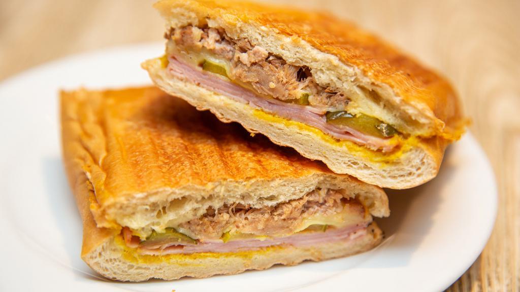 Cuban · Ham, house slow roasted pork, swiss mustard, pickles.