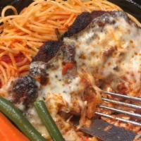 Chicken Parmesan · Topped with mozzarella and tomato sauce.