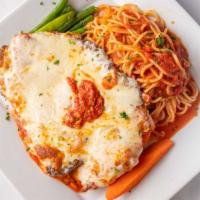 Chicken Parmesan · Topped with mozzarella in a fresh tomato sauce. served with spaghetti.