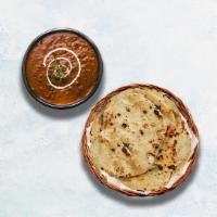 Dal Makhani & Butter Naan · Black lentils and red kidney beans slow cooked with herbs, butter, and cream. Served with In...