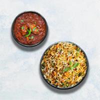 Chicken Curry & Vegetable Biryani · Boneless chicken cooked in Indian style with ginger, garlic, onion and tomato masala. Served...