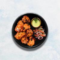 Achari Chicken Tikka · Cubes of cottage cheese marinated in a special blend of yogurt and pickling spices, glazed i...