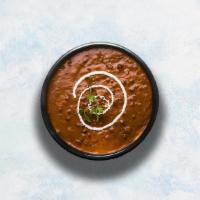 Dal Makhani · Black lentils and red kidney beans slow-cooked with herbs, butter and cream.
