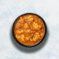 Aloo Gobi · Diced potatoes and cauliflower simmered with onion, tomato and cashew based gravy.