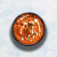 Butter Chicken · Grilled chicken morsels braised in a tomato and butter gravy, seasoned with aromatic herbs.