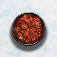 Lamb Vindaloo · Tender lamb morsels marinated in vinegar and garlic cooked to perfection with hot Indian aro...