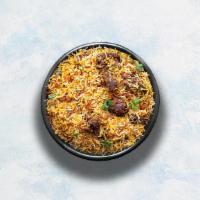 Goat Biryani · Long grain basmati rice cooked with tender goat and aromatic Indian herbs.