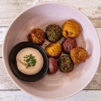 Rainbow Falafel · An assortment of falafel made with purple potato, beets, parsley and butternut squash. Serve...