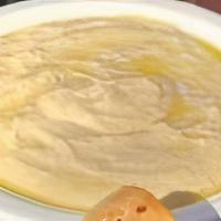 Hummus · Chickpeas mashed into a paste with lemon juice and flavored with tahini.