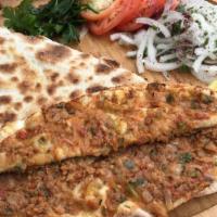 Lahmacun (Meat Pie) · Picked for you. Anatolia's version of ancient Turkish meat pie with ground lamb, topped with...