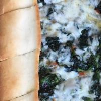 Spinach Pide · Thin crust topped with spinach and mozzarella cheese.