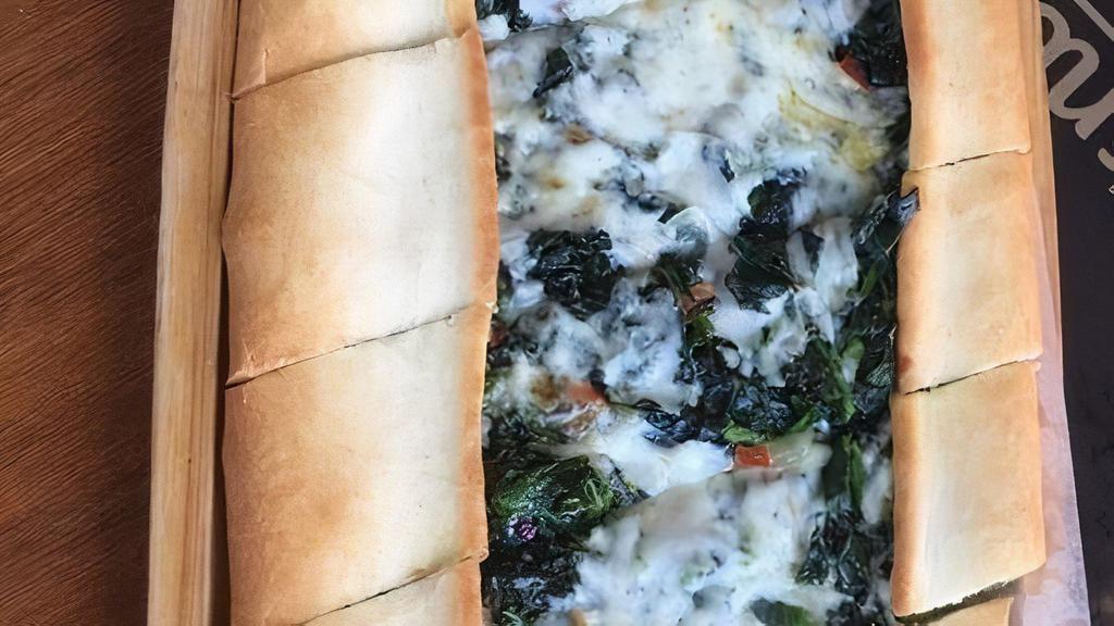 Spinach Pide · Thin crust topped with spinach and mozzarella cheese.