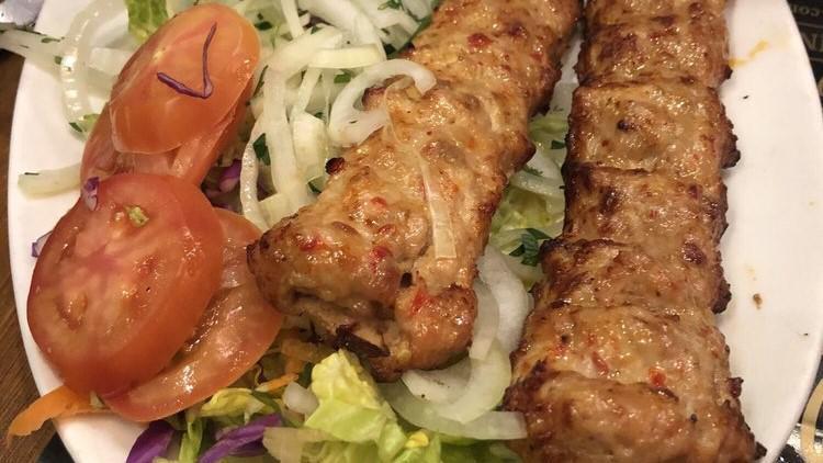 Chicken Adana · Chopped grilled on skewers chicken flavored with red bell peppers gently spiced with paprika and garlic.