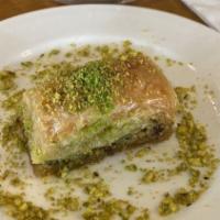 Baklava & Kinds · Sweet pastry made of extremely thin sheets of filo dough layered with chopped nuts and honey...