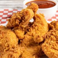 Mild Chicken Tenders · Delicious chicken tenders, tossed in Mild hot sauce, and fried to perfection.