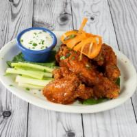 Wings · Jumbo wings tossed in buffalo or barbecue sauce.