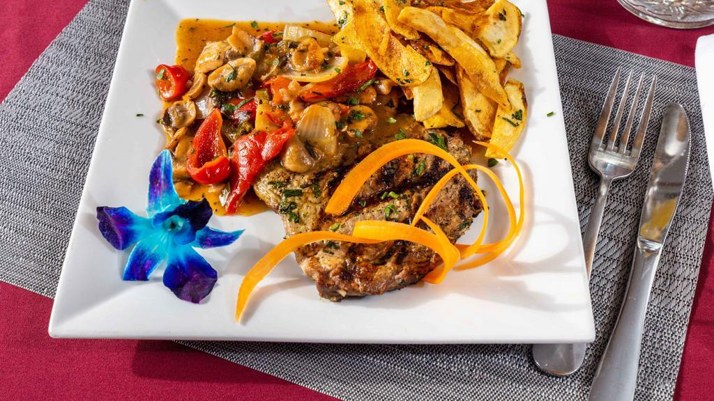 Steak Giambotta · Ribeye steak sauce with mushrooms, peppers and onions and topped with homemade garlic-seasoned Italian fries.