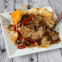Double Cut Pork Chop Giambotta · Double-cut pork chop sautéed with mushrooms, peppers and onions and topped with homemade gar...