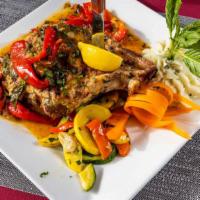 Double Cut Pork Chops With Vinegar Peppers · Double-cut pork chop sautéed with vinegar peppers, served with mixed vegetables and garlic m...