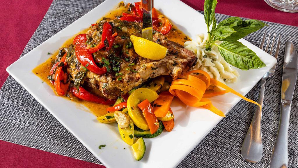 Double Cut Pork Chops With Vinegar Peppers · Double-cut pork chop sautéed with vinegar peppers, served with mixed vegetables and garlic mashed potatoes.