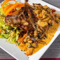 Double Cut Pork Chop Ala Caesar · Topped with sun-dried tomatoes, mushrooms in a light creamy brandy sauce complimented with a...
