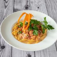 Penne Alla Vodka Sauce · Penne pasta in a vodka sauce topped with fresh tomatoes.