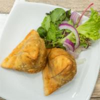 Samosa · Two pieces. Crispy pastry turnover filled with ground chicken or vegetables.