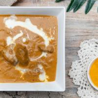 Korma · Choice of lamb, beef, chicken, keema, or vegetable cooked with cream and almonds, sweet spic...