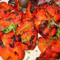Chicken Tandoori · Spring chicken marinated in mild spices and bbq.